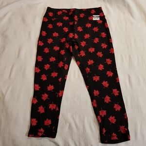 Canada Day women's size medium black leggings with maple leaf design